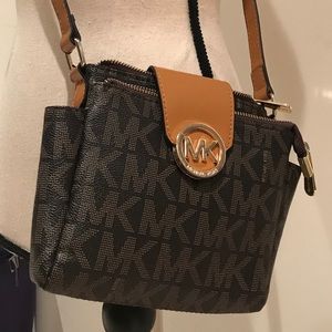 Brown cross body purse with gold logo